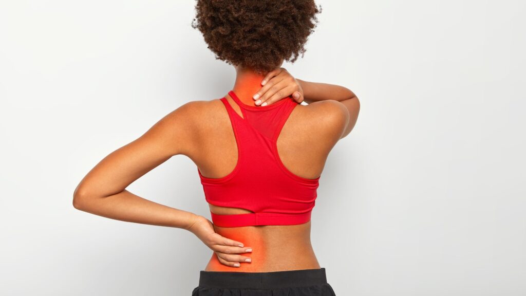 A girl is suffering from chronic back pain