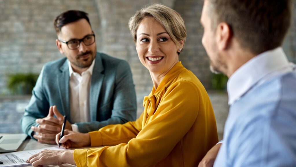 Real estate estate agents having a land registry contract in a meeting