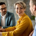 Real estate estate agents having a land registry contract in a meeting