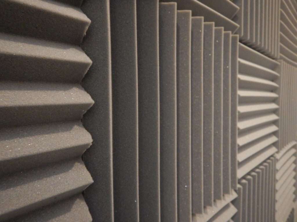 Textured decorative concrete wall with a modern geometric pattern for aesthetic and acoustic appeal.