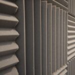 Textured decorative concrete wall with a modern geometric pattern for aesthetic and acoustic appeal.