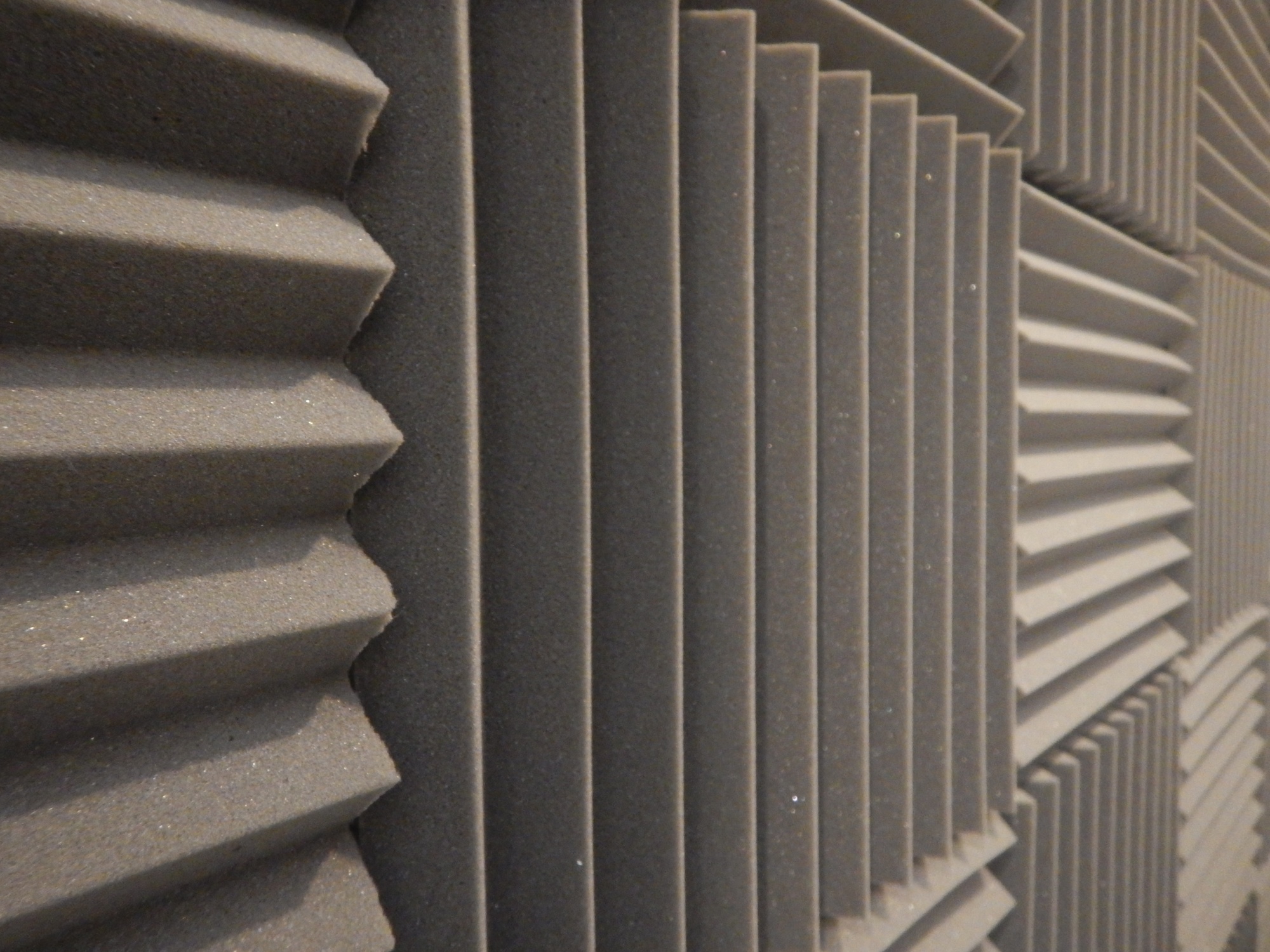 Textured decorative concrete wall with a modern geometric pattern for aesthetic and acoustic appeal.